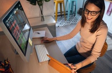 Woman researches stocks on her computer