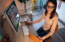 Woman researches stocks on her computer