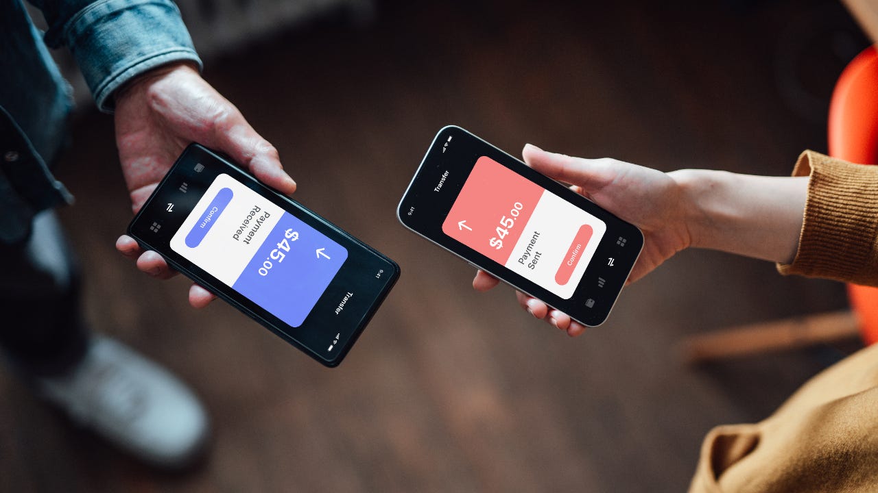 Two phones are exchanging money via app