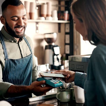 customer paying in a coffee shop