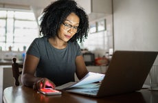 woman working at home on paperwork