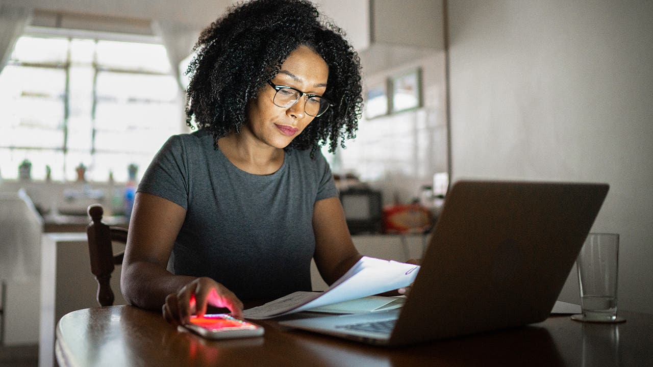 woman working at home on paperwork