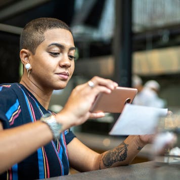 woman depositing a check on her phone