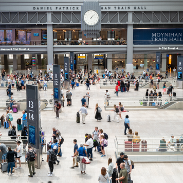 Travelers move through the Moynihan Train Hall in Manhattan