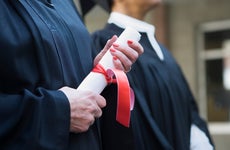 Close-up of hands with a diploma
