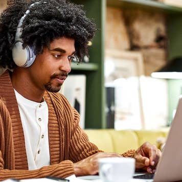 man working on his computer