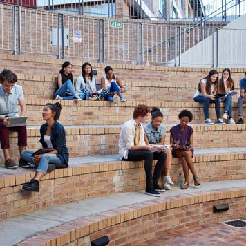Group of college students sits on campus