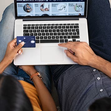couple shopping online with a credit card