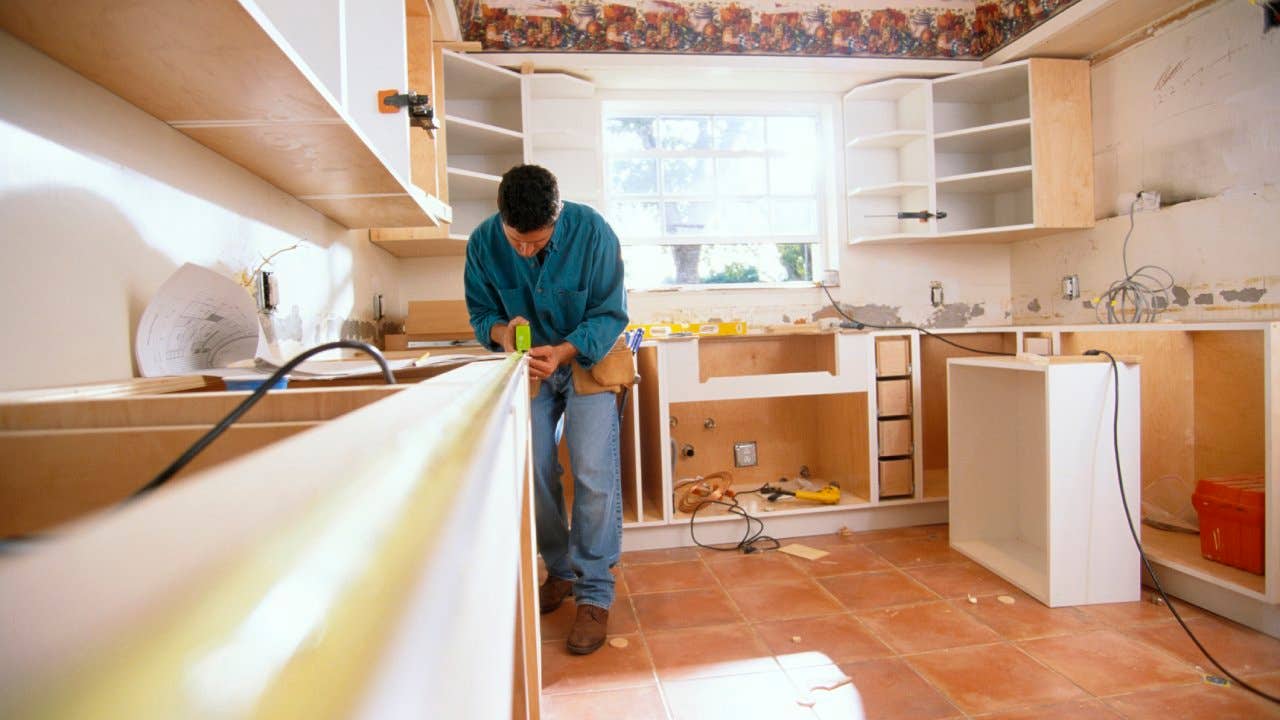 Contractor measuring kitchen counters