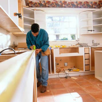 Contractor measuring kitchen counters