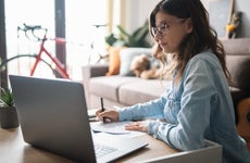 Woman is on laptop at home