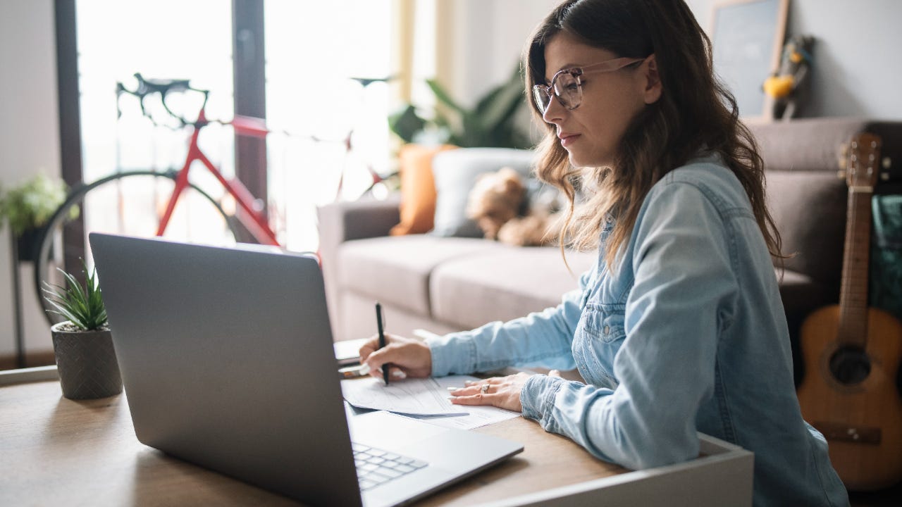 Woman is on laptop at home