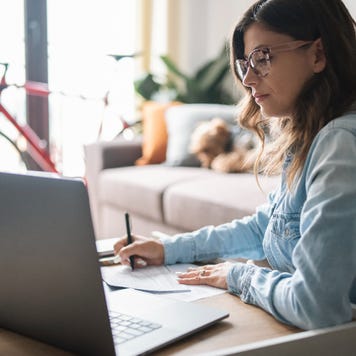 Woman is on laptop at home