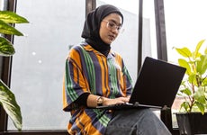 young woman working on her laptop