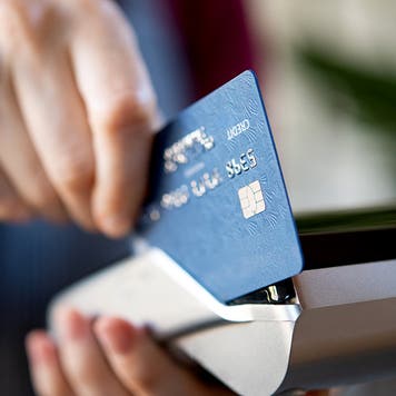waitress swiping a credit card