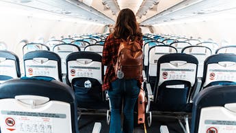 woman deboarding a commercial plane