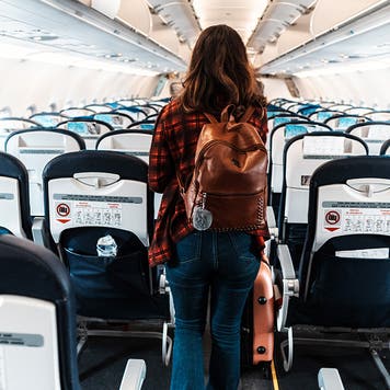 woman deboarding a commercial plane