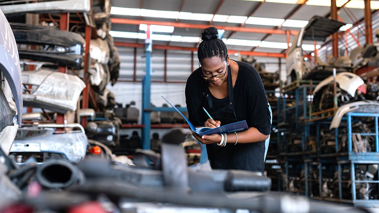 woman working in an auto shop