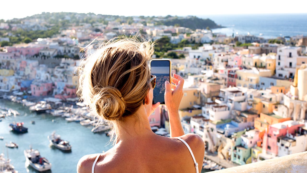 woman taking pictures in italy