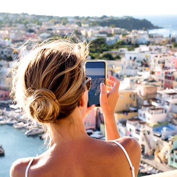 woman taking pictures in italy