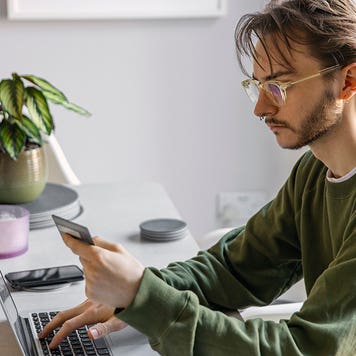 non binary person making an online purchase
