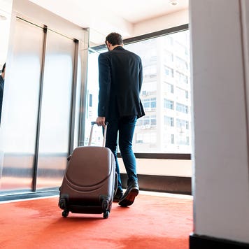 businessman leaving a hotel