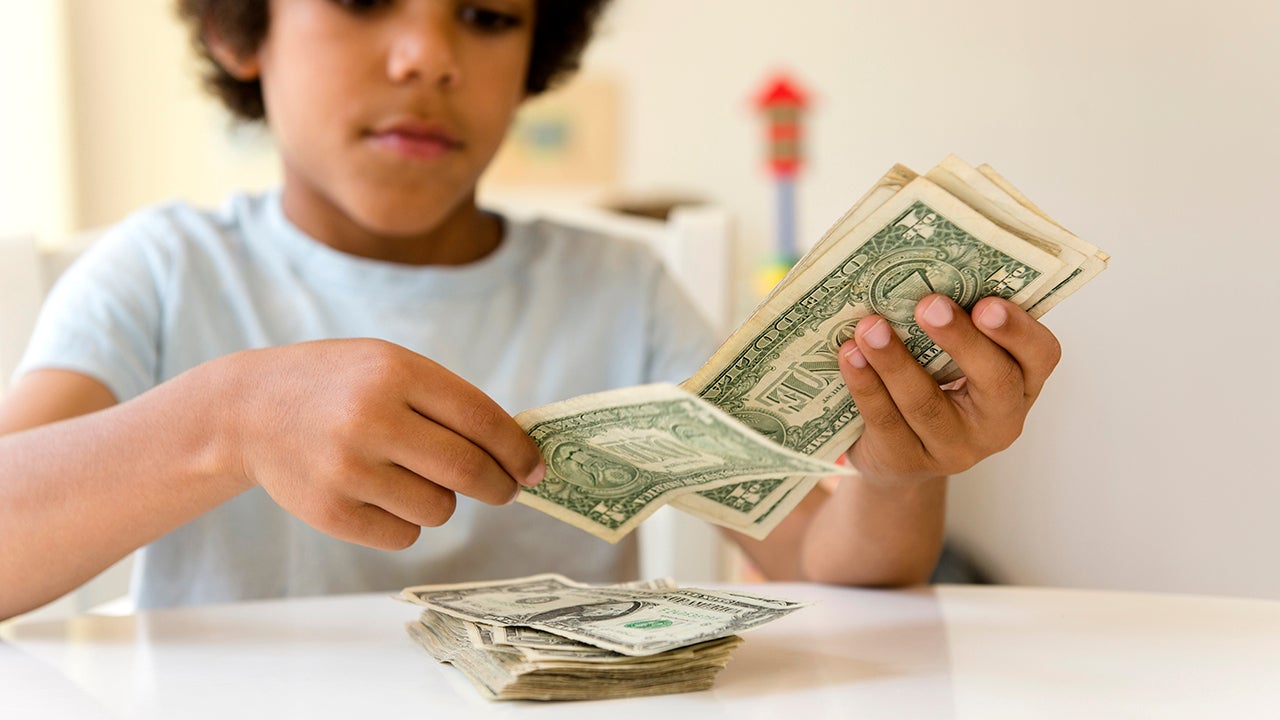 child counting cash