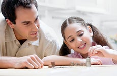 Father and daughter counting coins
