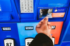 woman purchasing gas with a credit card