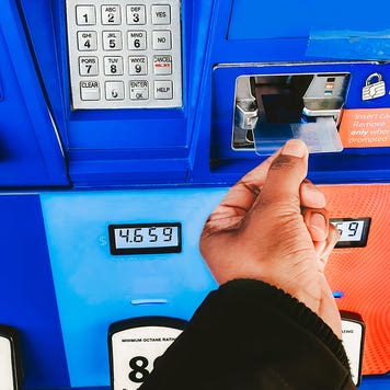woman purchasing gas with a credit card
