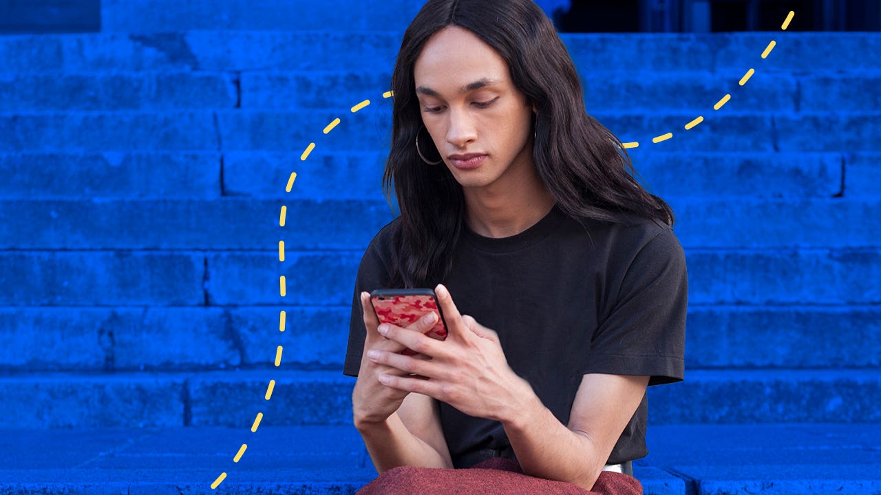 woman looking at a phone outside