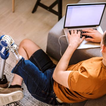 young man working on his laptop in his living room