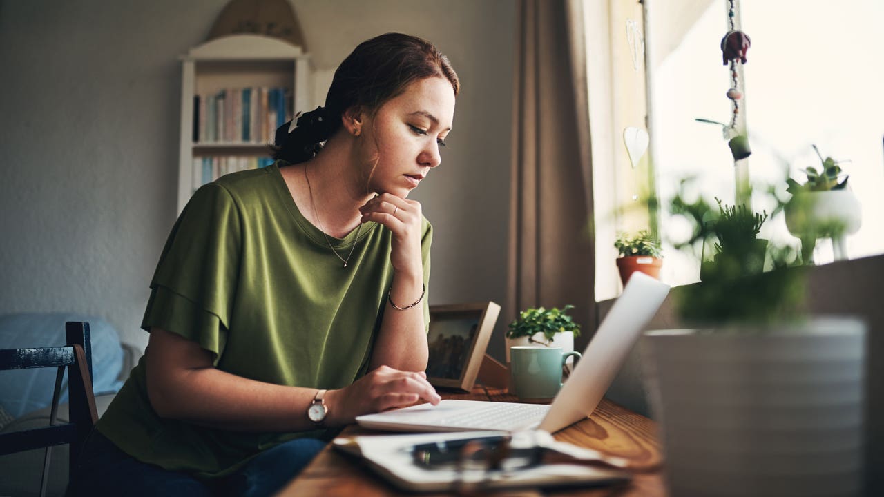 woman working on her laptop at home