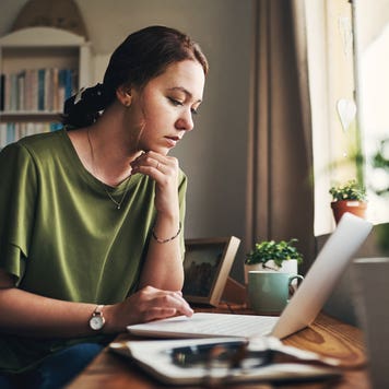 woman working on her laptop at home