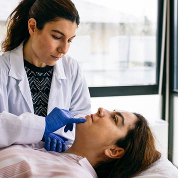 woman receiving a beauty treatment in a medical office