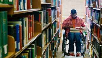 college student who uses a wheelchair in the library