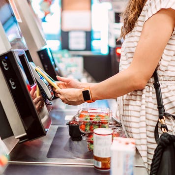 woman at grocery slef checkout