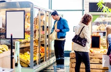 customers buying groceries at a market