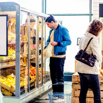 customers buying groceries at a market