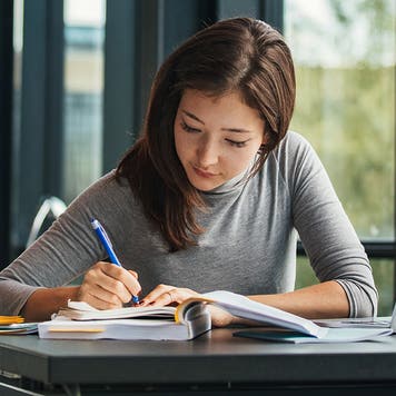 student working in the library