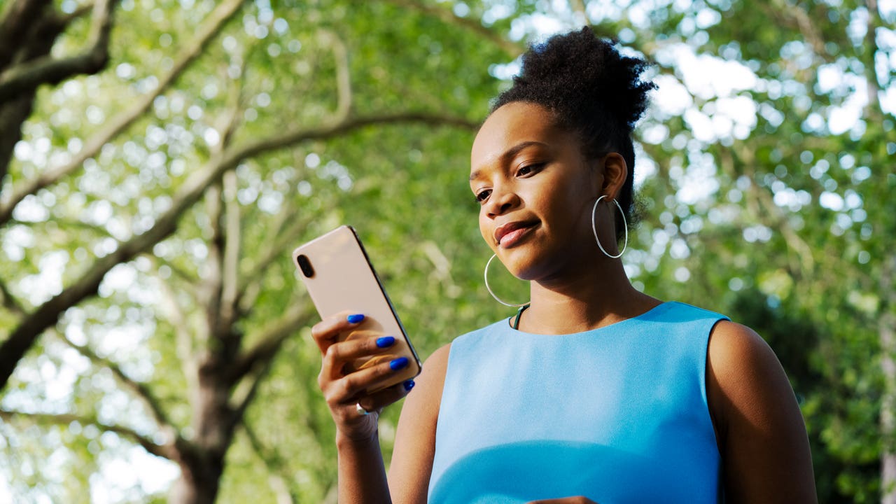 woman looking at her cell phone