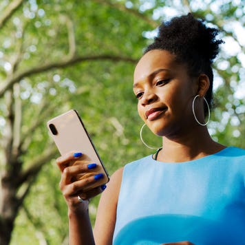 woman looking at her cell phone