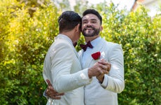 Gay couple dancing at their wedding