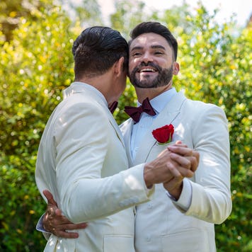 Gay couple dancing at their wedding