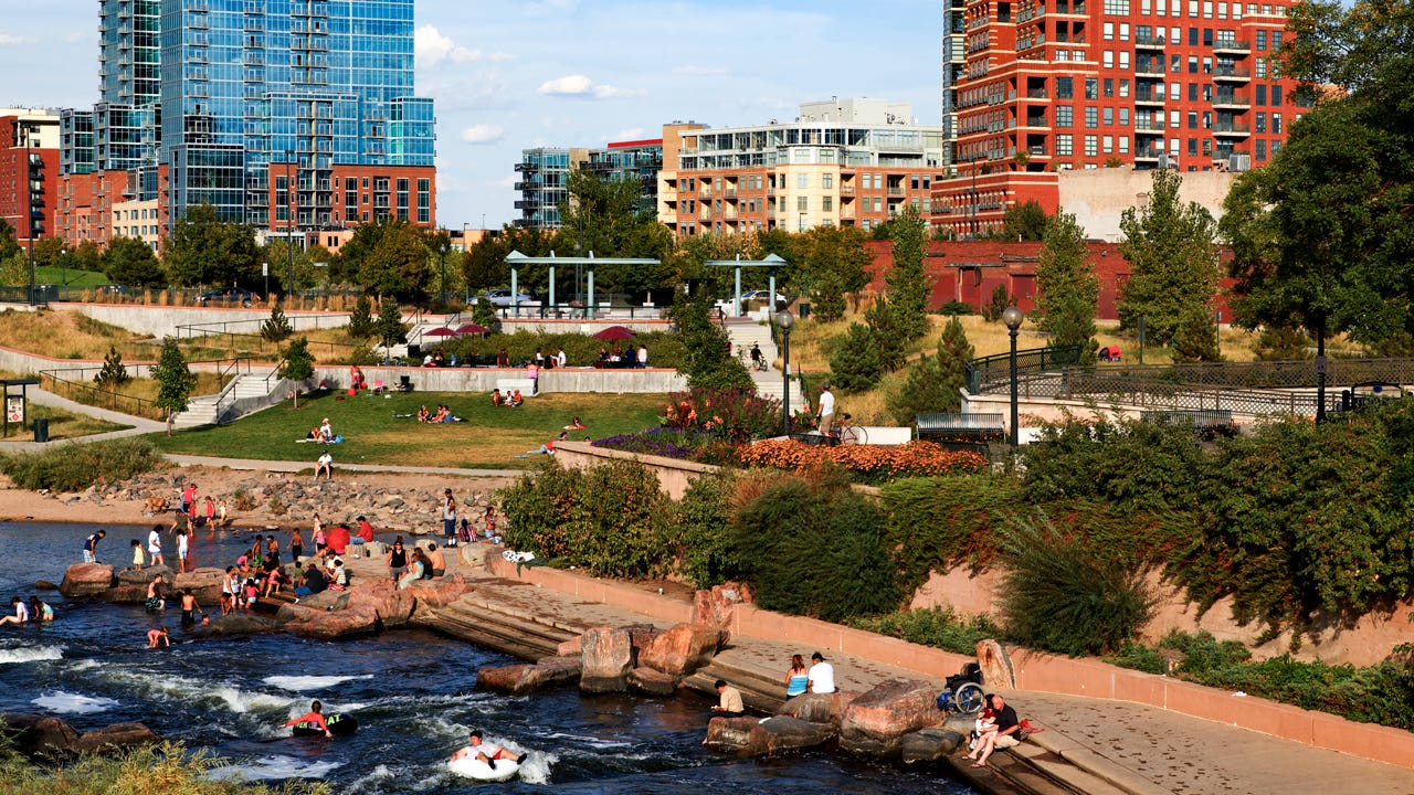 people in Commons Park along the Platte River in Denver, Colorado
