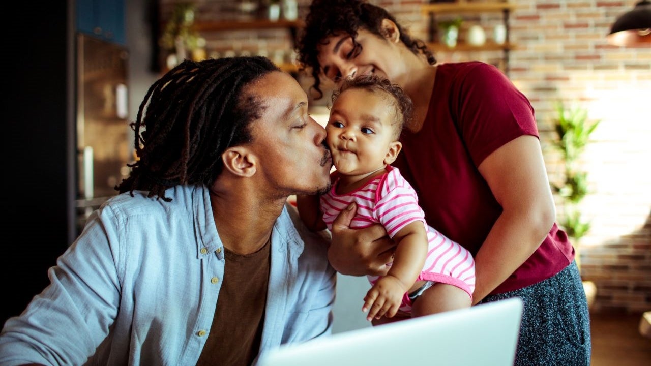 Family using a laptop together