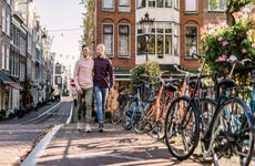 couple walking down the street in Amsterdam