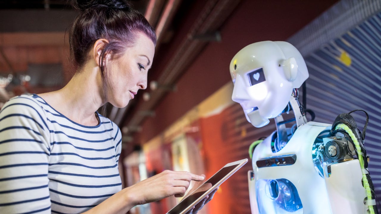 A woman interacts with a robot