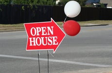 Open house sign with balloons