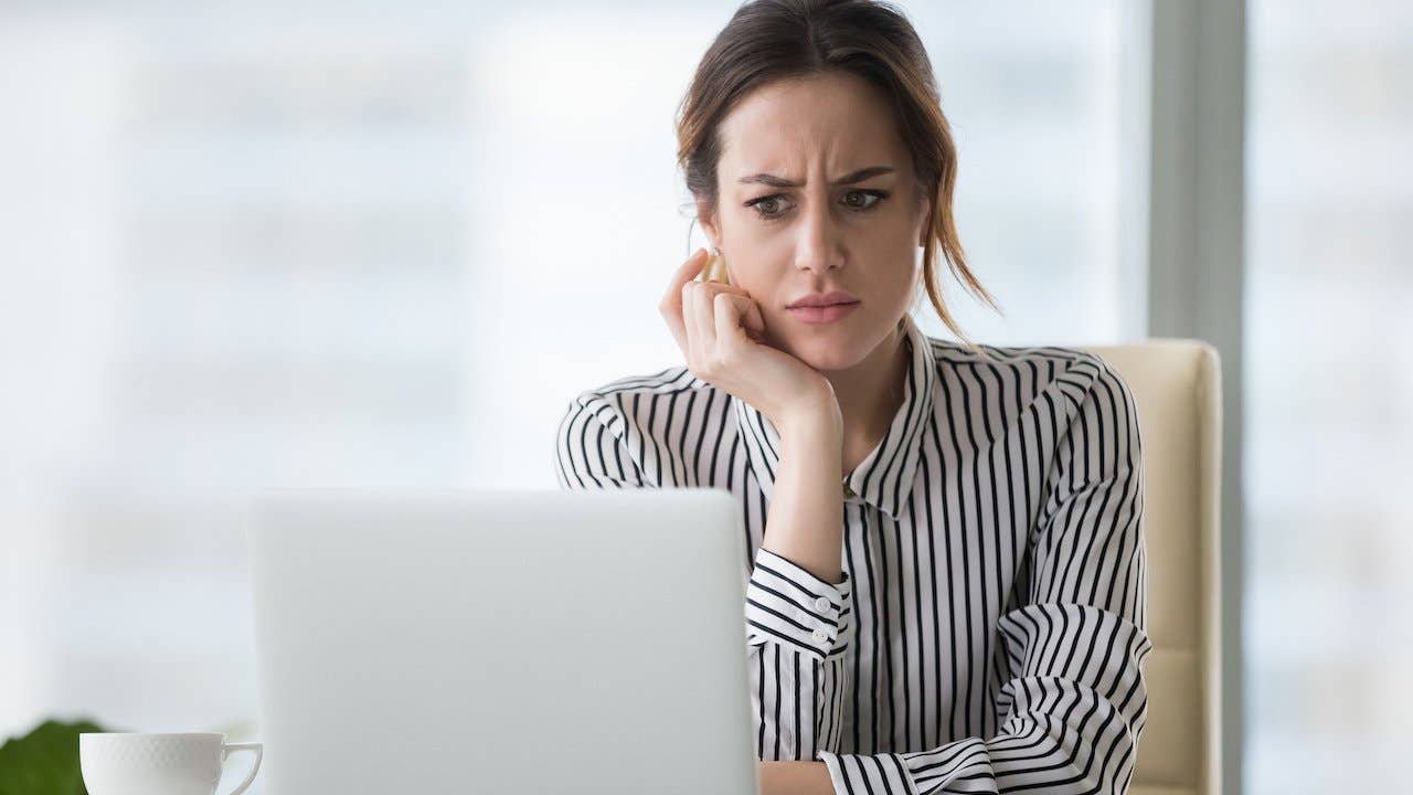 Person staring concerned at their laptop